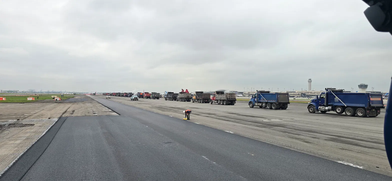 Wide view of an airfield runway under open sky, representing Elevare's field and infrastructure project support